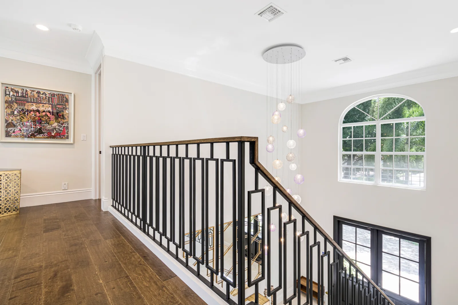 The staircase of a custom home in South Florida by SouthShore Builders